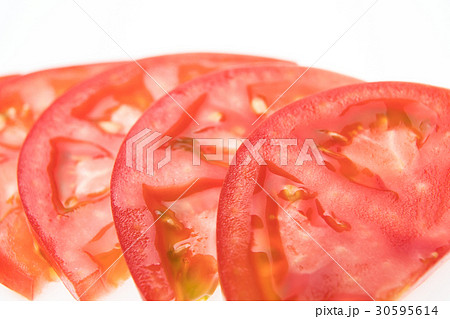 トマト 輪切り 断面 瑞々しいの写真素材