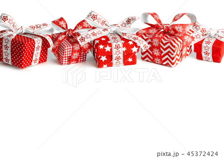 Fabric decorating bow hanging on Christmas tree with copy space in