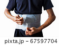 old man with back pain wearing back support beltの写真素材