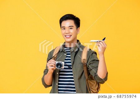 Happy asian man traveller in hipster outfit spending free time