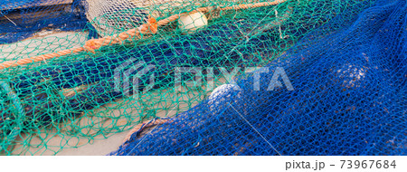 Industrial Fishing Equipment Fishnets and Fishing Lines Lying on