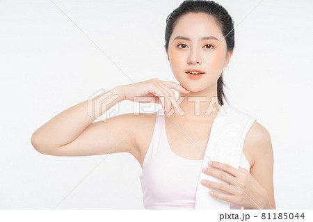 slim athletic woman working out with battle rope in gym. fitness