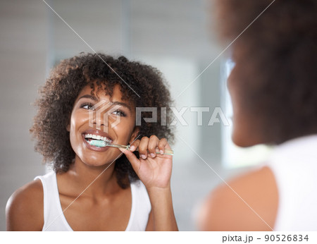 Enjoying the Beat. a Smiling Ethnic Woman Enjoying Her Headphones