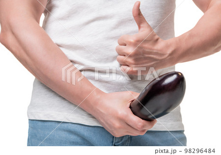 Man in underwear standing isolated on grey background covering his