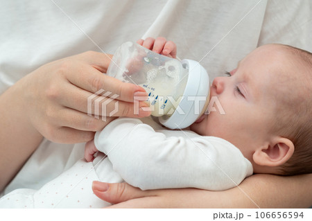 Portrait Of A Cute Toddler Drinking Milk From The Bottle, One Year Old Food  Concept Stock Photo, Picture and Royalty Free Image. Image 122146550.